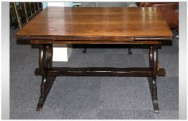 An Oak `Ercol` Style Draw Leaf Table, 2ft6``x4ft. 6ft fully extended.