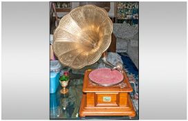 HMV Reproduction Gramophone with a wind up mechanism, with a pressed glass horn, in a walnut case.