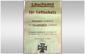 WW2 German style Luftschutz Paper Sandbag with a dug up WW2 style Polish Iron Cross