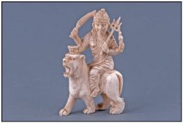 Indian Ivory Mythological Figure Of The Hindu Mother Goddess Durga, seated on a lion. Stands 3.5