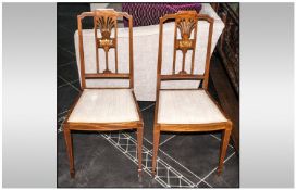 Two Stand Chairs, with inlaid detail, upholstered seats, on four splayed legs.