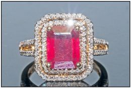 14ct Gold Ruby And Diamond Ring, Set With A Central Emerald Cut Ruby (Estimated Weight 5.50ct)