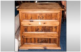 Pine Chest of Drawers with three long drawers with heavy wrought iron handles to the centre. With a