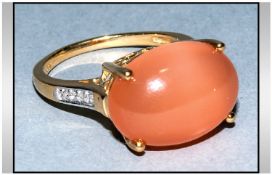 Peach Moonstone and Diamond Ring, 10ct oval cut cabochon peach moonstone, a large stone with a good