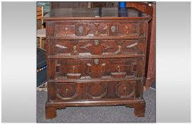 A Fine Late Seventeenth Century Oak Chest of Drawers, with cushion and geometric moulding.  Four