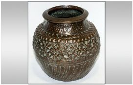 Middle Eastern Copper Embossed Water Jug with floral decoration. signed of tinning. 8.5`` in