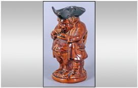 Rockingham Treacle Glaze `Snuff Taker` Toby Jug, probably designed by Daniel Greatbatch, an English