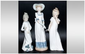 Nao by Lladro Figures ( 3 ) In Total. Figure of Young Girls, Sizes 12.5, 11.25 & 10.25 Inches High.