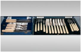 Two Boxed Flatware Sets including eight knives and forks and fish knives and forks with bakelite