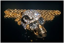 White Crystal and Black Enamel Skull Pendant with chain, the dome of the skull encrusted with white