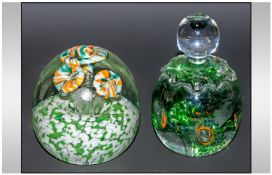 Two Vintage Glass Paperweights, one circular and one in the shape of a bottle, both inset with