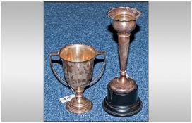 Silver Twin Handled Trophy Of Plain Typical Form, Height 6 Inches Raised On A Black Socle Together