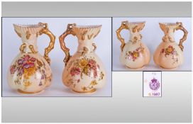 Royal Worcester Fine Pair Of Blush Ivory Jugs with handpainted floral decoration and gold borders.