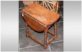 Miniature Oak Gateleg Drop Leaf Table with bobbin legs, with cross stretchers. 18 by 19 inches.