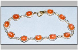 Peach Moonstone Bracelet, oval cabochons of the ethereal peach moonstone, totalling 12.75cts, set