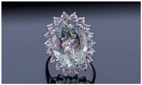 Green Amethyst and White Topaz Cocktail Ring, a large oval cut green amethyst of 11.5cts, set in a