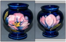 Moorcroft Small Vase, Coral Magnolia Design on Blue Ground. Excellent Condition. Height 3.5 Inches.