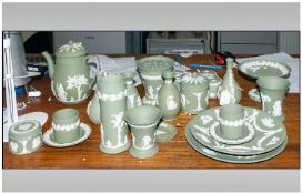 Wedgwood Green & White Jasperware Comprising tea pot, pin dishes, lidded trinket pots, vases,