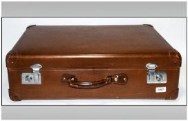 Brown Leather Suitcase with chrome lock plates.