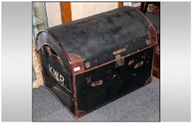 A Leather Clad Dome Top Wicket Travelling Trunk with leather carrying handles to the sides & brass
