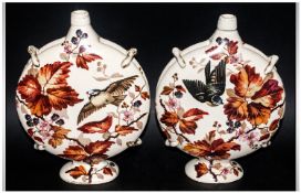 Victorian Pair Of Ceramic Handpainted Moonflasks, decorated with birds, leaves and berries on cream