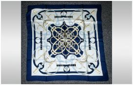 Hermes Silk Scarf `Eperon D`or`, in navy blue, pale yellow, shades of light blue and white, in a