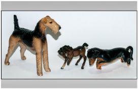 Three Ceramic Dog Figures comprising Terrier, Miniature Dachshund and Beswick horse ( with broken