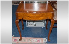 `The King John Canteen Of Cutlery, Viners Of Sheffield` Serpentine fronted Walnut table, raised on