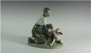 Lladro Figure `Woman With Calf` model number 4827. Issued 1972-1981. Sculptor Salvador Furio,
