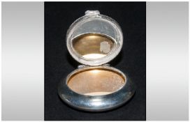 Silver Compact Case, circular in shape, plain finished, with a hinged compartment, complete with a