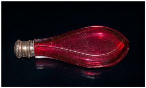 A French Ruby Glass Tear Shaped Body Faceted Cut Miniature Perfume Bottle with a silvered metal