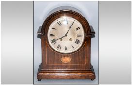 Edwardian Oak Carved Mantle Clock with a roundsteel dial, bevelled glass face. German movement