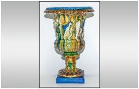 Large Campgna Shape Vase, decorated with raised classical figures below a grape vine, to the main