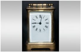 Antique French Brass Carriage Clock with carrying handle. With white enamel dial. No makers name.