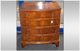 Georgian Style Bow Fronted Chest of Drawers. Four graduating drawers to front and brass handles,