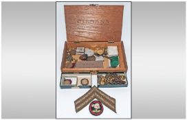 Assorted Collectables including medals, badges, army stripes, coins etc. Contained in wooden Havana