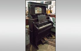 American Pedal Organ With A Small Mirrored Back with shelves made by Backard, Fort Wayne IND.USA.