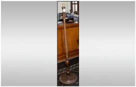 Mahogany Standard Lamp with Turned Column and Circular Base. 57`` in Height.