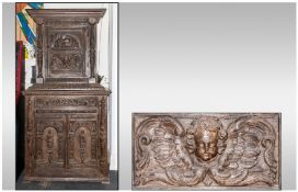 A Dutch Flemish Carved Oak Cabinet on cupboard base, profusely decorated with elements of earlier