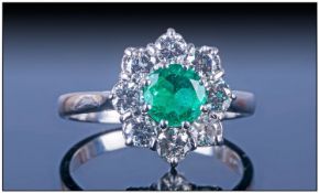 18ct White Gold Set Emerald And Diamond Cluster Ring. The central natural single stone Colombian