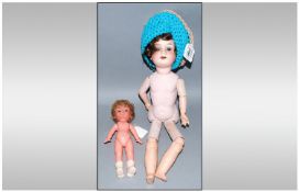 Armand Marseille DRGM 246/1 Doll, with bisque head and composition body. With opening and closing