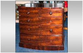 An Edwardian/Victorian Bow Fronted Mahogany Chest with two drawers below three graduating long
