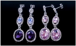 Two Pairs of Crystal Drop Earrings, both of similar style, one with large, deep amethyst purple