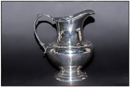 Reed & Barton Sterling Silver `Pilgrim` Pattern Helmet Shaped Jug, Marked sterling. 5`` in height.