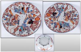 Large Imari Plate depicting Samurai on horse back & courtesans in a spiral decoration around the
