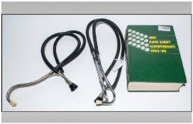 Medical Interest comprising two stethoscopes and medical journal.