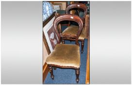 Pair Of Victorian Mahogany Balloon Back Dining Chairs, with overstuffed seats on round turned legs
