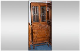 1930`s Oak Leaded Top Double Door Bureau Bookcase fitted into the bureau on three long drawers,