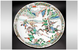 Chinese 18th Century Famille Verte Shallow Bowl decorated with warriors at the battle with the