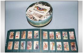 Tin Box Containing a Mixed Lot of cigarette cards, 3  WW1 silk postcards. Together with Wills